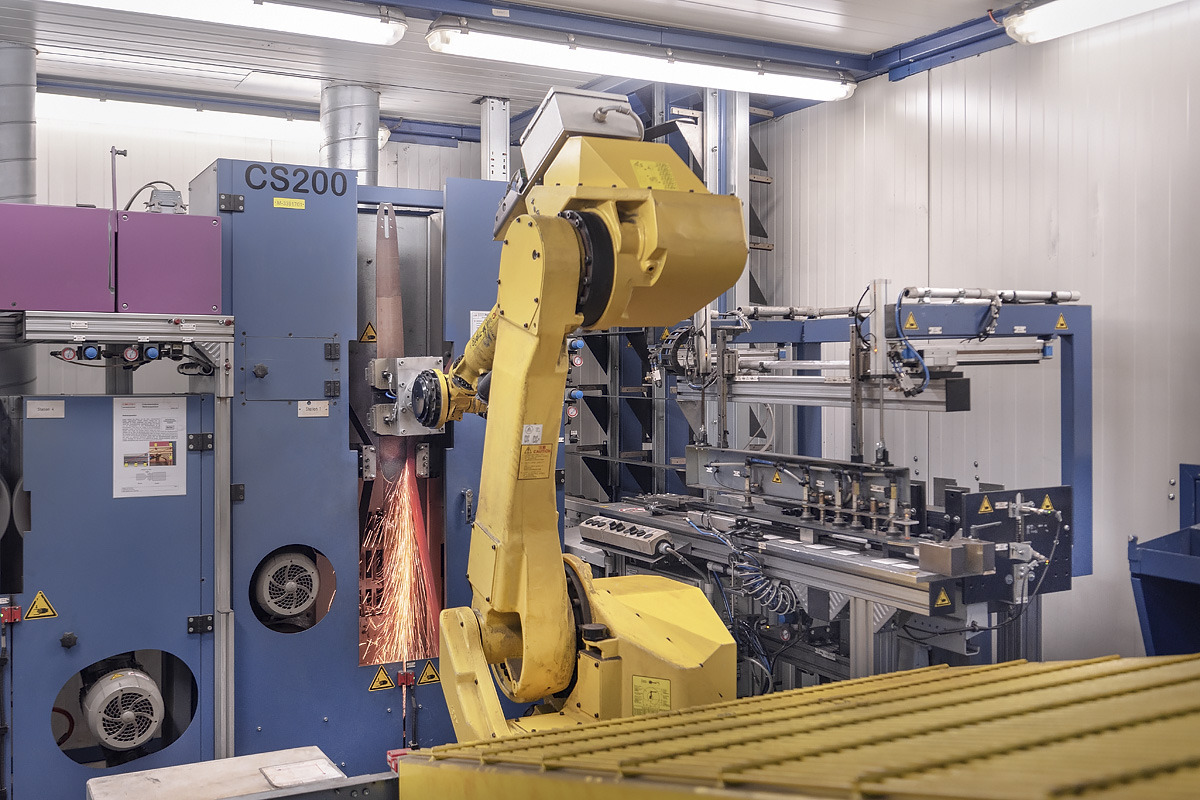 A machine precisely grinds the material transition