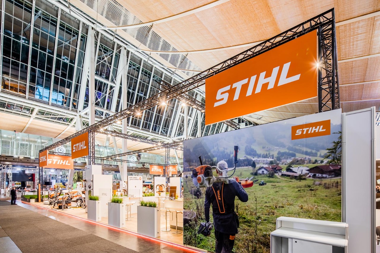 STIHL trade fair stand with chainsaws and personal protective equipment