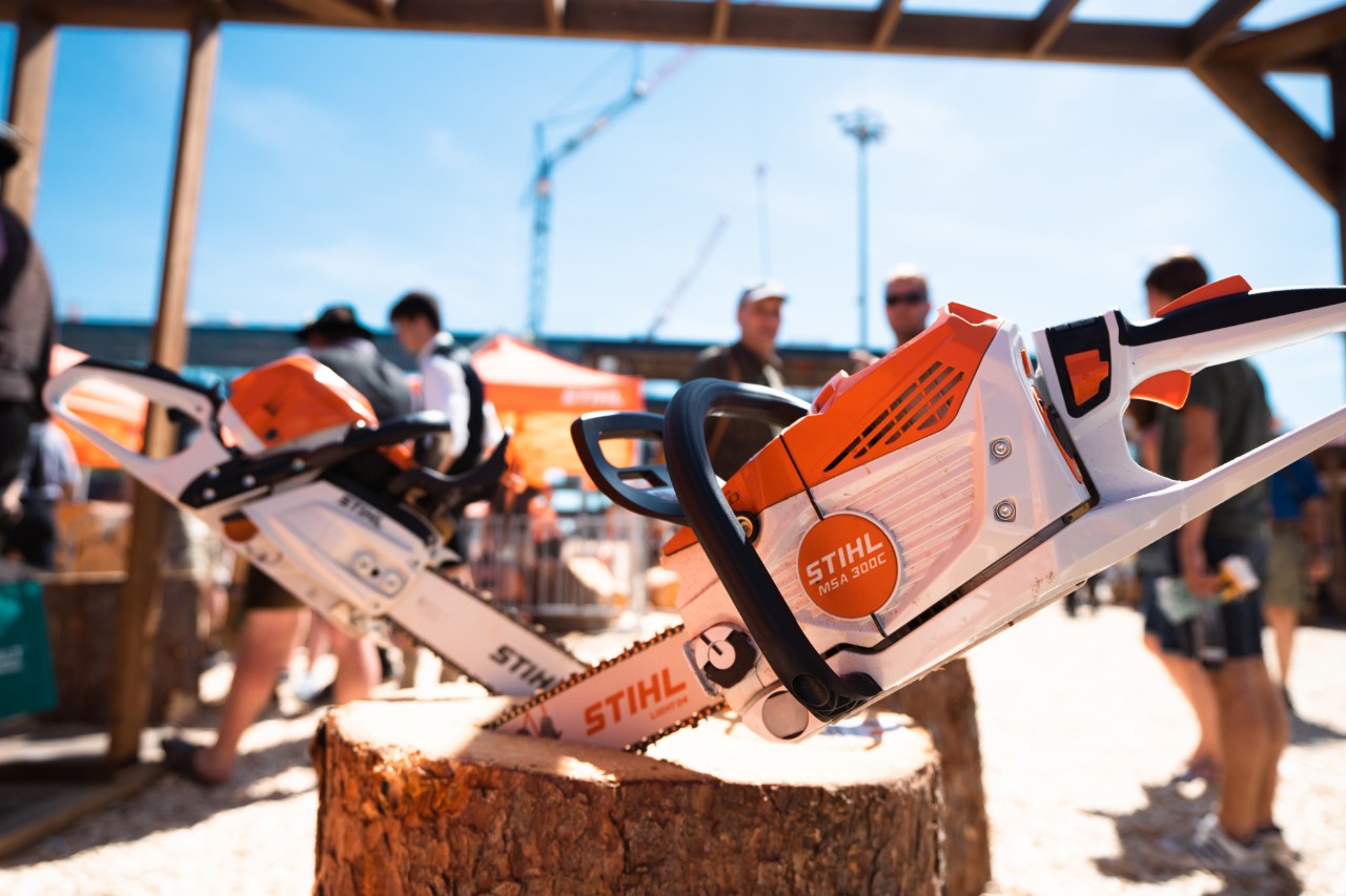 STIHL indoor exhibition stand, including chainsaws and protective equipment on display